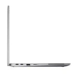A silver laptop shown from a side profile view, open at a slight angle, with ports visible along the bottom edge, set against a plain white background.