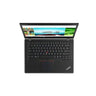 A black Lenovo ThinkPad laptop shown open from a top-down view on a plain white background. The screen is on and displays a colorful webpage, while the keyboard, trackpad, and red TrackPoint nub are clearly visible.