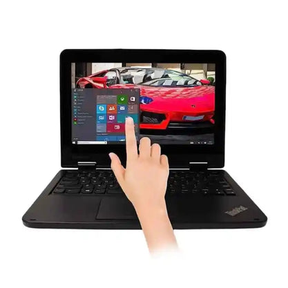Laptop with a hand interacting with the screen displaying a car image and Windows interface.